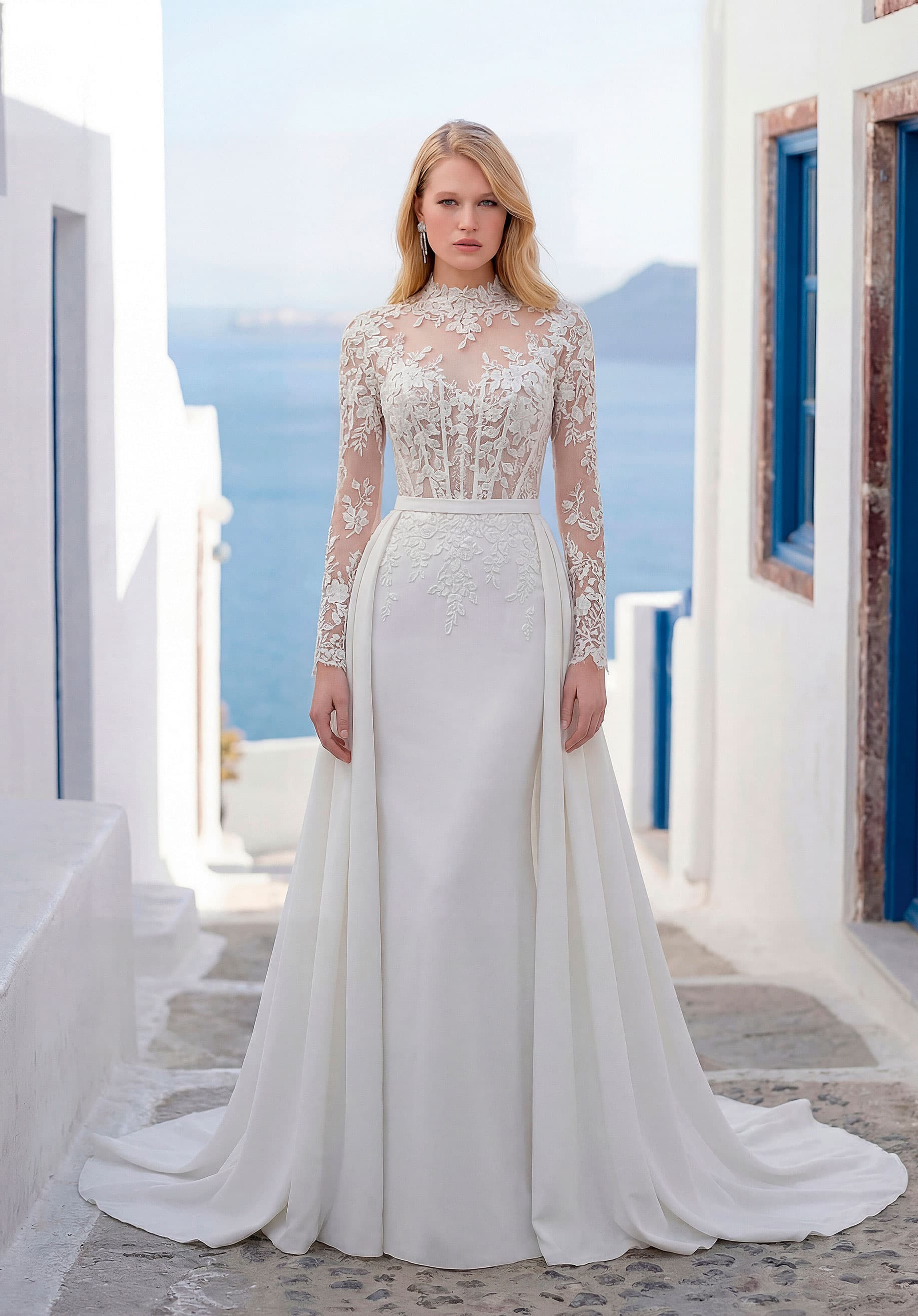 High neck long sleeve lace bodice sheath gown with a detachable overskirt from the Luna collection by Morilee