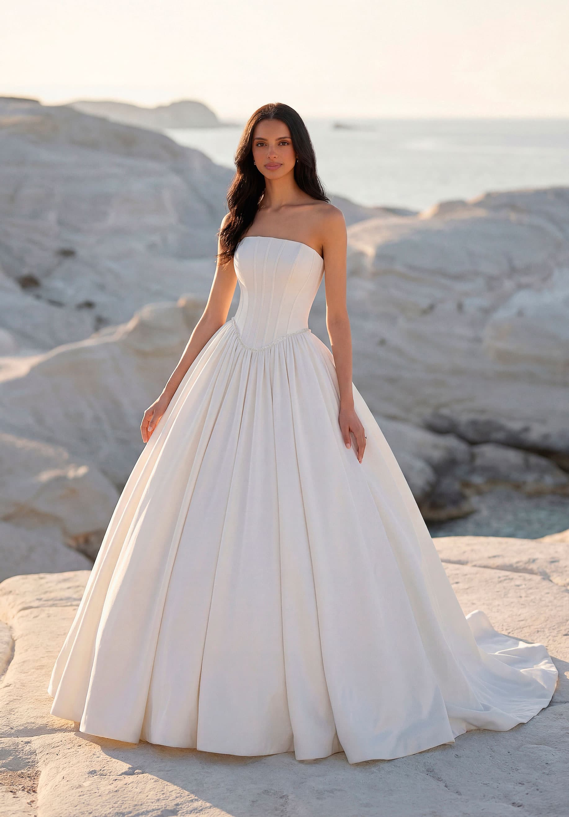 Strapless satin ball gown with a corset bodice and pleated skirt from the Luna collection by Morilee